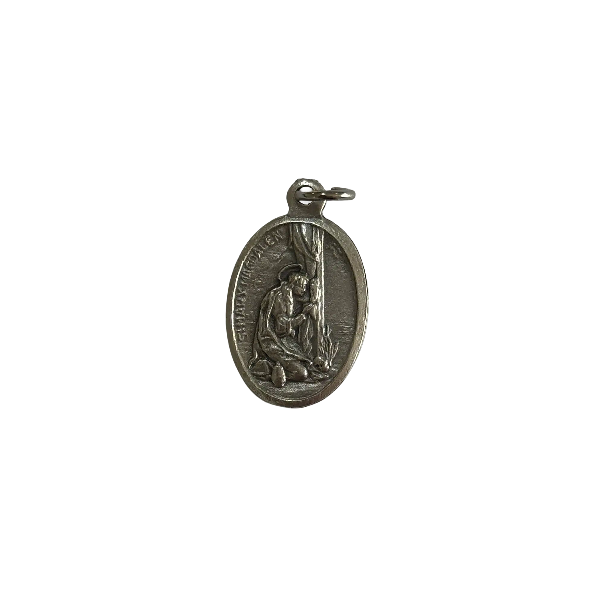 Silver St Mary Magdalene medal depicting the saint kneeling in penitence at the foot of a cross.