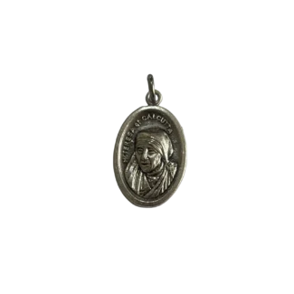 Silver St Mother Teresa medal showing a detailed bust relief of the saint wearing her traditional habit.