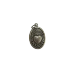 Reverse side of a silver St Alice medal featuring the Sacred Heart surrounded by a crown of thorns.