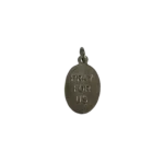 Reverse side of a silver St Thomas Aquinas medal with a block stamped Pray For Us inscription.